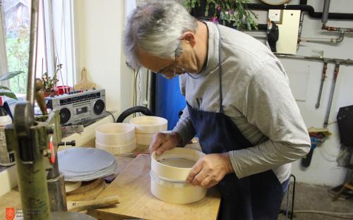 Andrej Mihelič while making Ribnica woodenware. 
