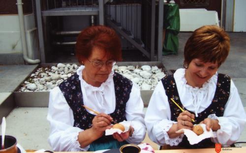 Decorating eggs to celebrate šempav. 