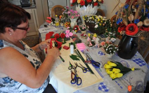 Anica Tomšič while making paper flowers. 