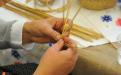Making braided straws for straw hats. 