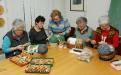 Members of the Bobbin lace Association Cvetke Žiri while making bobbin laces.